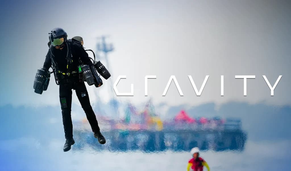 Jet suit pilot hovering above water with “GRAVITY” text and a blurred pier in the background.
