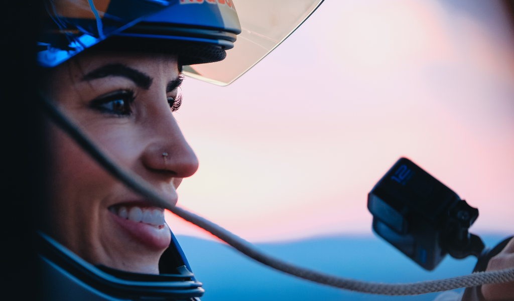 Leticia Bufoni with a helmet and GoPro on preparing to sky dive from a plane